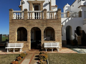 Casa para 6 a 100m de la playa jardín compartido, El Palmar